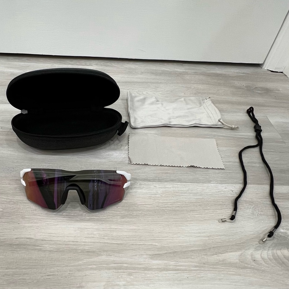 Brand new, white, wraparound Torege sunglasses.